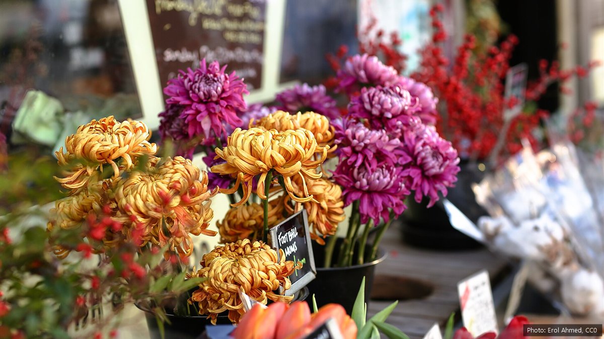 Bunches of chrysanthemums and tulips for sale at a flower stall before Mother's Day